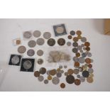 A quantity of UK and world coins including eleven 1980s UK £2, and a 1969 US Kennedy half dollar