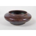 A brown glazed porcelain ink wash with incised dragon decoration, Chinese Chenghua 6 character