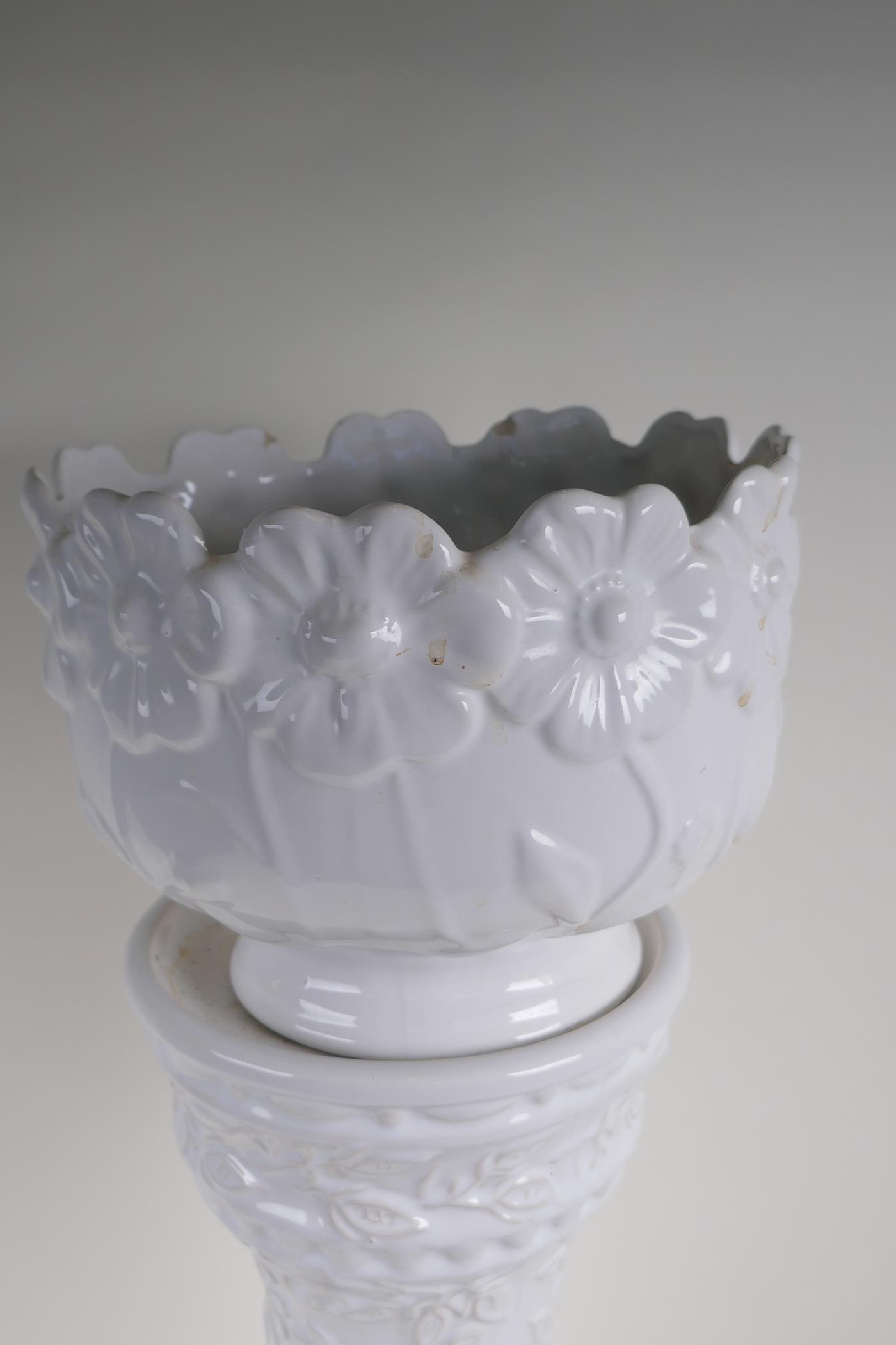 A German white glazed pottery jardiniere on stand with embossed flower and vine decoration, 67cm - Image 3 of 3