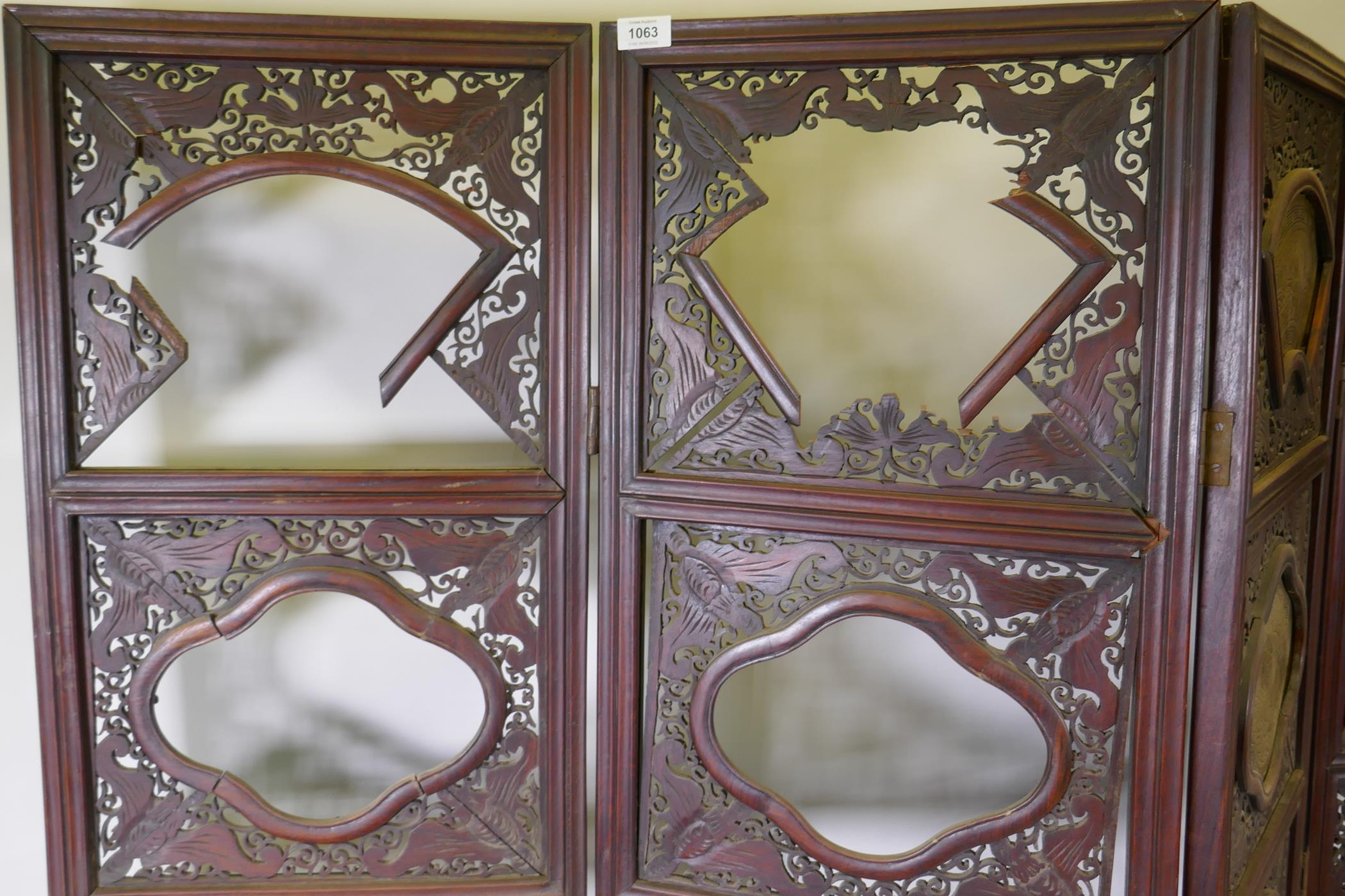 A Chinese hardwood four fold screen with fretwork panels and brass inset plaques, each panel 170 x - Image 5 of 5