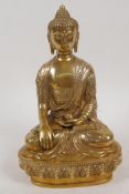 A gilt bronze figure of Buddha seated in meditation, vajra mark to base, 8" high