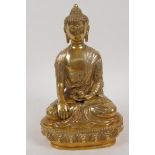 A gilt bronze figure of Buddha seated in meditation, vajra mark to base, 8" high