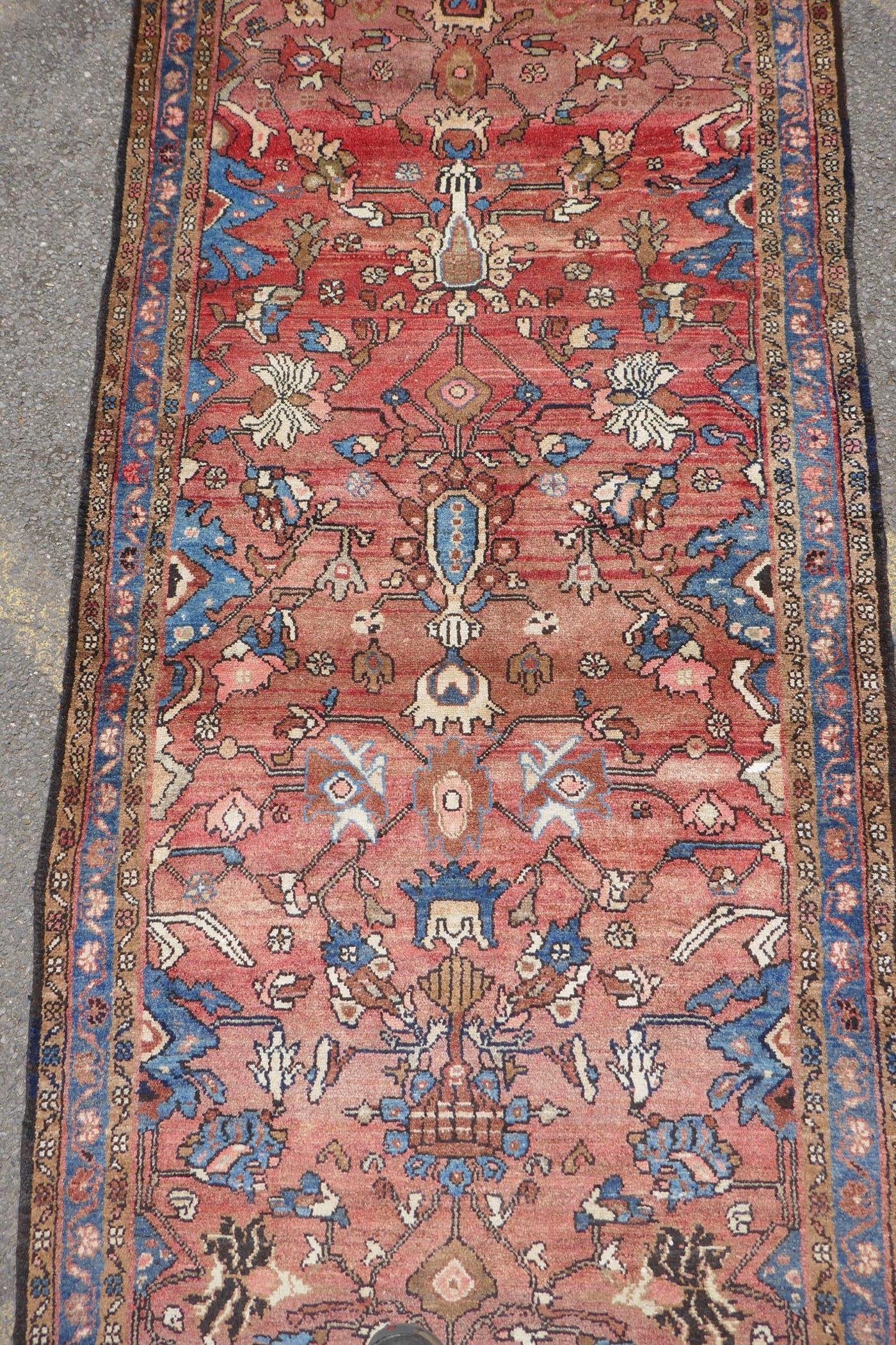 A washed terracotta ground Persian Hamadan runner, with all over floral pattern, 108cm x 284cm - Image 3 of 6