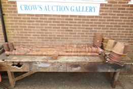 A large quantity of terracotta plant pots of varying sizes, approx 300, ranging from 7cm to 29cm