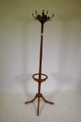 A Victorian walnut hat stand with fluted details and four splayed supports, AF, 76" high