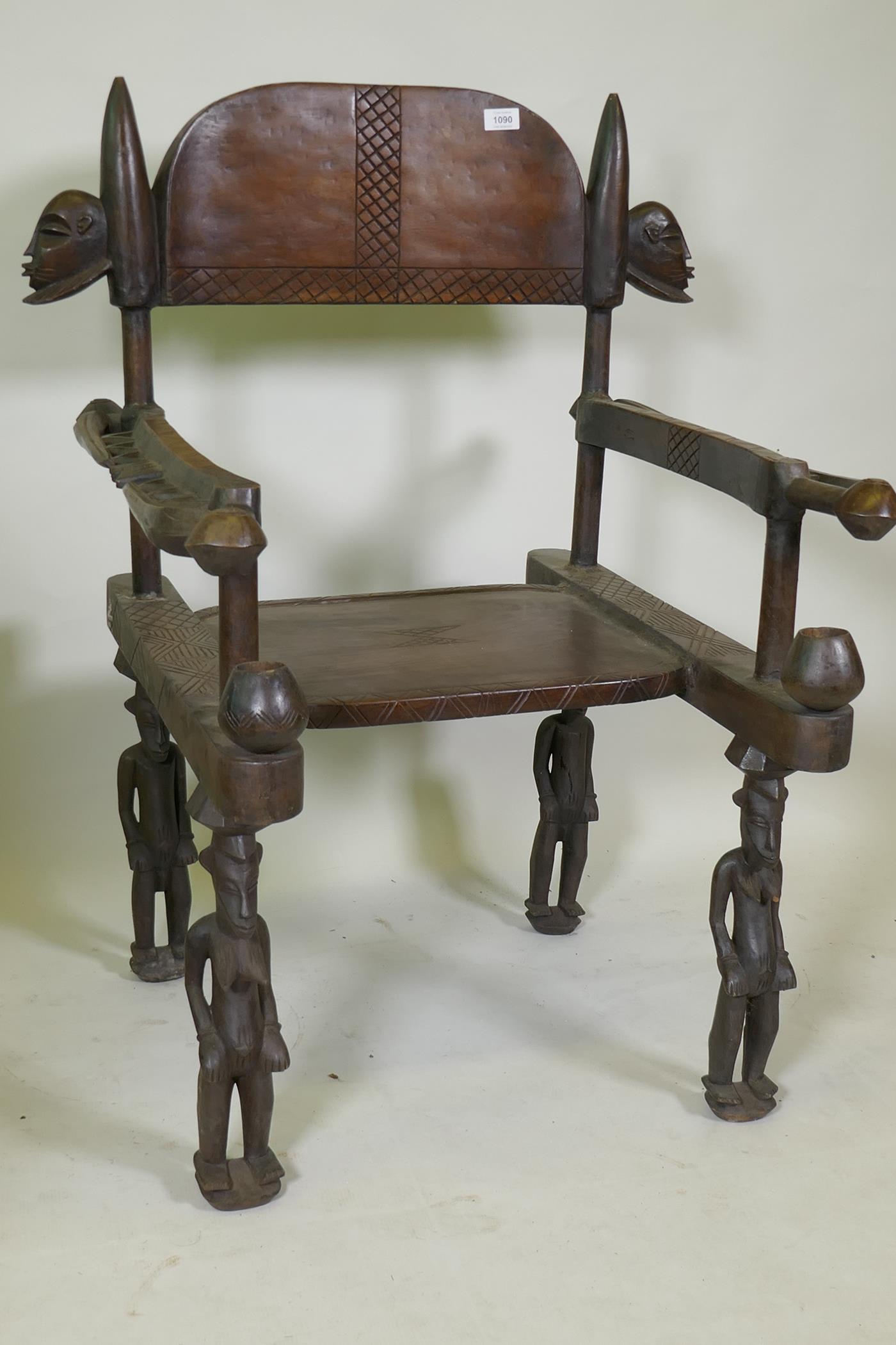 An African carved wood throne chair decorated with masks and geometric patterns, the legs carved - Image 2 of 4