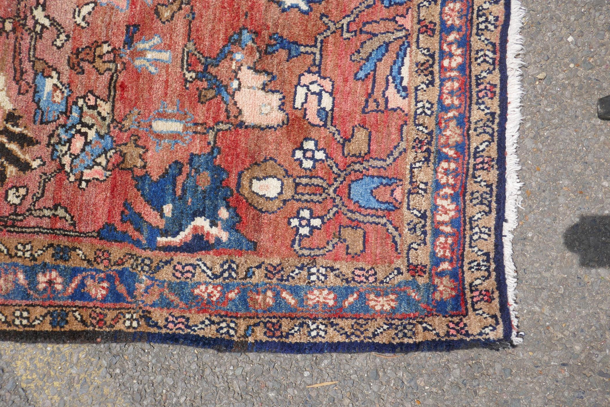 A washed terracotta ground Persian Hamadan runner, with all over floral pattern, 108cm x 284cm - Image 5 of 6