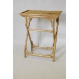 A mid century bamboo butler's tray and folding stand, 66 x 44 x 83cm