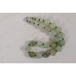 A string of graduated cabbage jade beads with 925 silver clasp, 42cm long