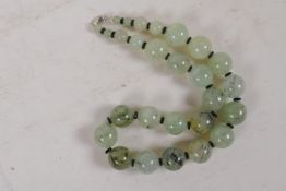 A string of graduated cabbage jade beads with 925 silver clasp, 42cm long