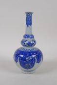 A Chinese blue and white porcelain stem vase with stylised floral decoration, mark to base, 18cm
