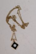 A 14ct gold enamel and seed pearl pendant on a rolled gold chain
