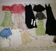 A collection of early C20th lady's and girl's silk and linen dresses, and a collection of