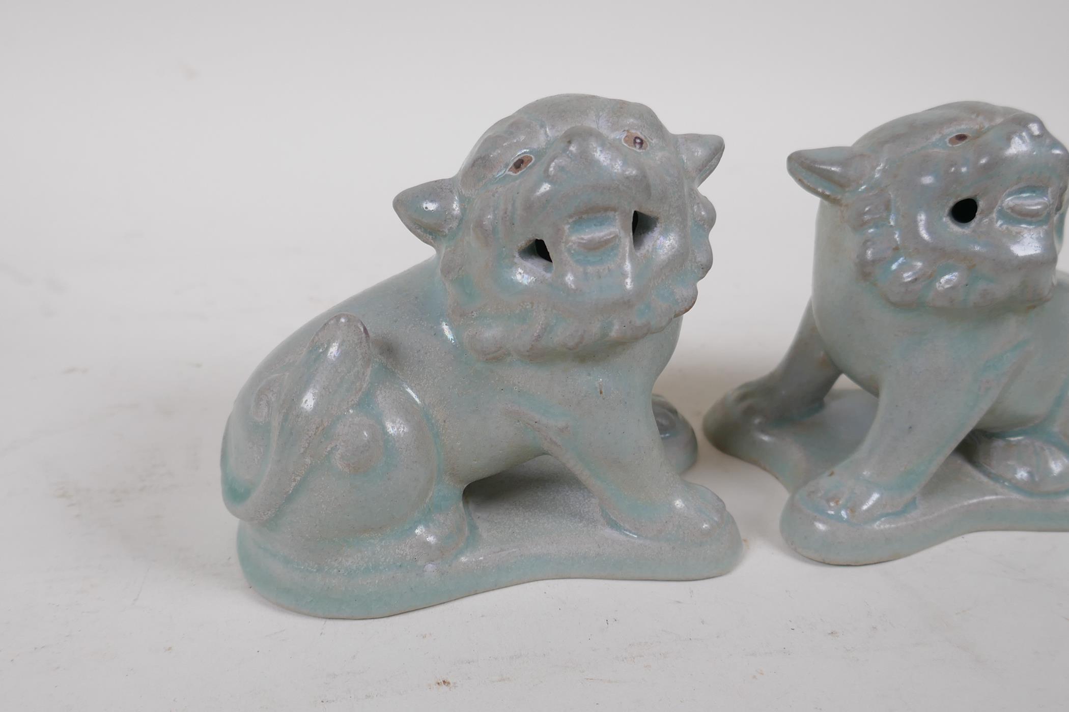 A pair of Chinese porcelain temple lions with ru-ware style glazes, 10cm high, 11cm long - Image 2 of 4