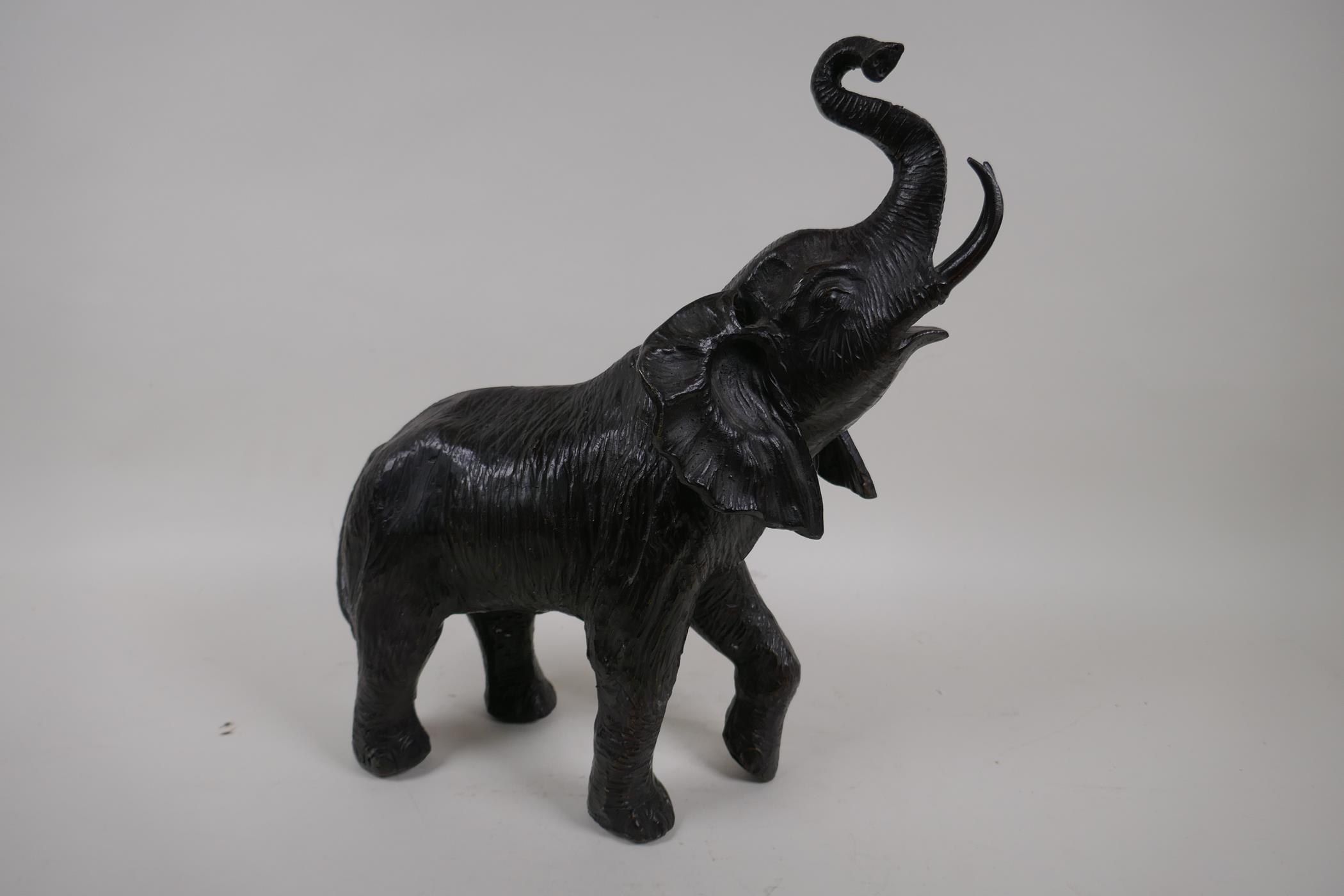 A bronze figure of an elephant, 13" high