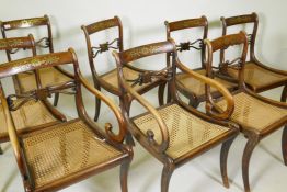 A set of eight (6+2) Regency dining chairs with rosewood grained decoration, inlaid brass back rails