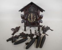 A vintage Black Forest cuckoo clock with weight driven movement, for restoration