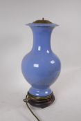 An antique Chinese blue glazed ceramic vase converted to a lamp, seal mark to base, drilled, vase