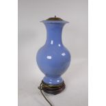 An antique Chinese blue glazed ceramic vase converted to a lamp, seal mark to base, drilled, vase