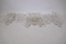 A large part suite of drinking glasses with etched vine decoration and cut details, consisting of