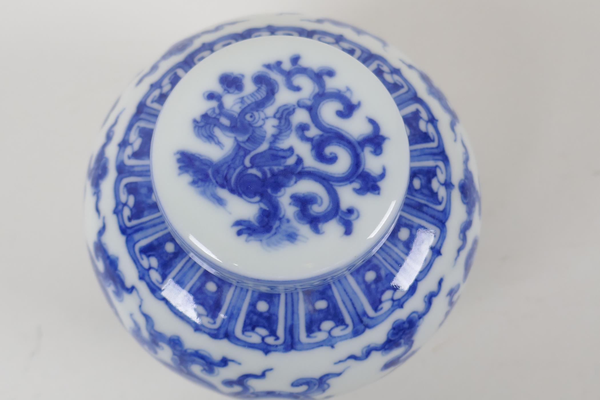 A Chinese blue and white porcelain ginger jar and cover, with scrolling dragon decoration, character - Image 5 of 7