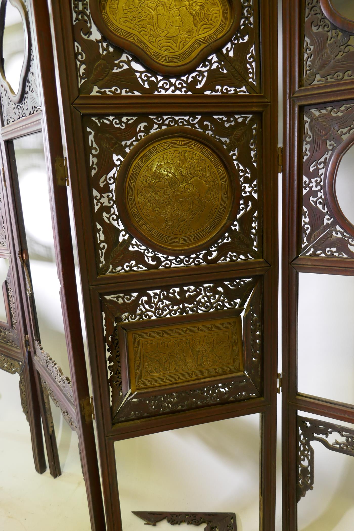 A Chinese hardwood four fold screen with fretwork panels and brass inset plaques, each panel 170 x - Image 3 of 5