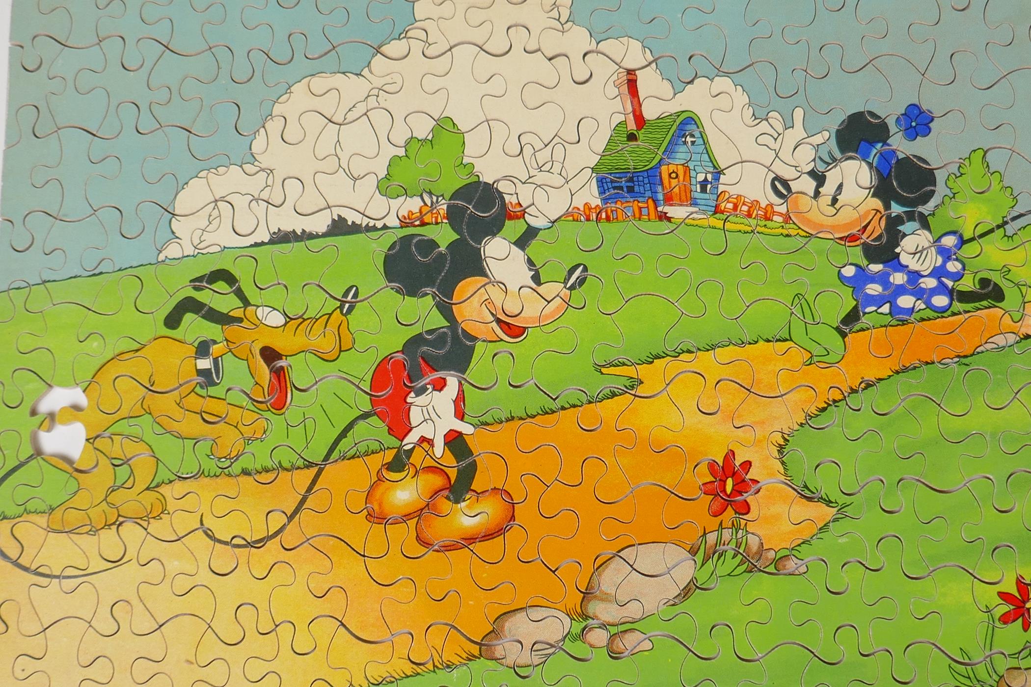 A 1930s Chad Valley wooden Mickey Mouse jigsaw puzzle, and a Parker Brothers clock, Tiddley Winks - Image 2 of 6