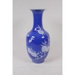 A blue glazed porcelain vase with raised white enamel peach tree decoration, Chinese Qianlong seal