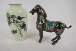 An Oriental cloisonne vase decorated with a bird on a flowering branch, 22cm high, and a brightly