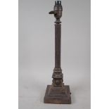 A silver plated table lamp with reeded column, the stepped base with applied satyr heads, 40cm