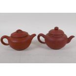 Two Chinese YiXing red earthenware teapots of squat form