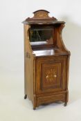 A Victorian inlaid rosewood purdonium with a mirror back, raised on castors, 39 x 35cm, 100cm high