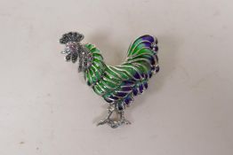 A silver and plique a jour brooch in the form of a cockerel, 5cm