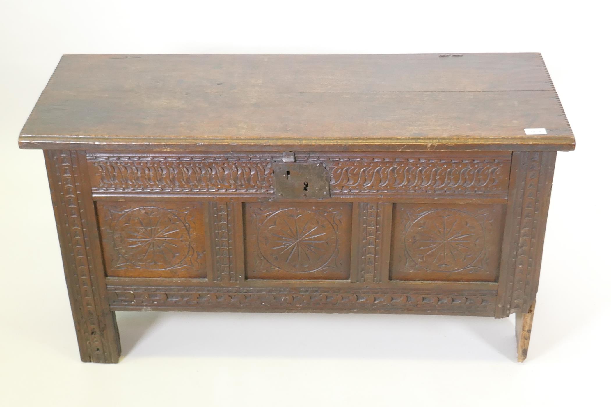 An C18th elm planked coffer with triple panel carved front, 108 x 43 x 60 cm - Image 2 of 5