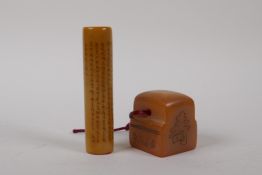 A Chinese amber soapstone cylinder seal with all over character inscriptions, and another, 9cm high