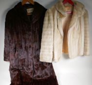 A vintage full length fur coat and a faux fur jacket