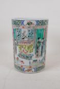 A famille vert porcelain brush pot with decorative panels depicting women and children in interior
