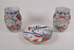 A pair of Chinese Imari ceramic jars, 18cm high, and a shaped dish, 23cm diameter