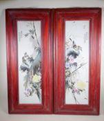 A pair of Chinese polychrome porcelain panels decorated with birds amongst flowers and bamboo, in