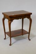 Victorian burr walnut card table with fold out top and undertier, raised on cabriole supports with