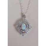 A 925 silver pendant necklace set with an oval opalite panel encircled by cubic zirconia, 2.5cm drop