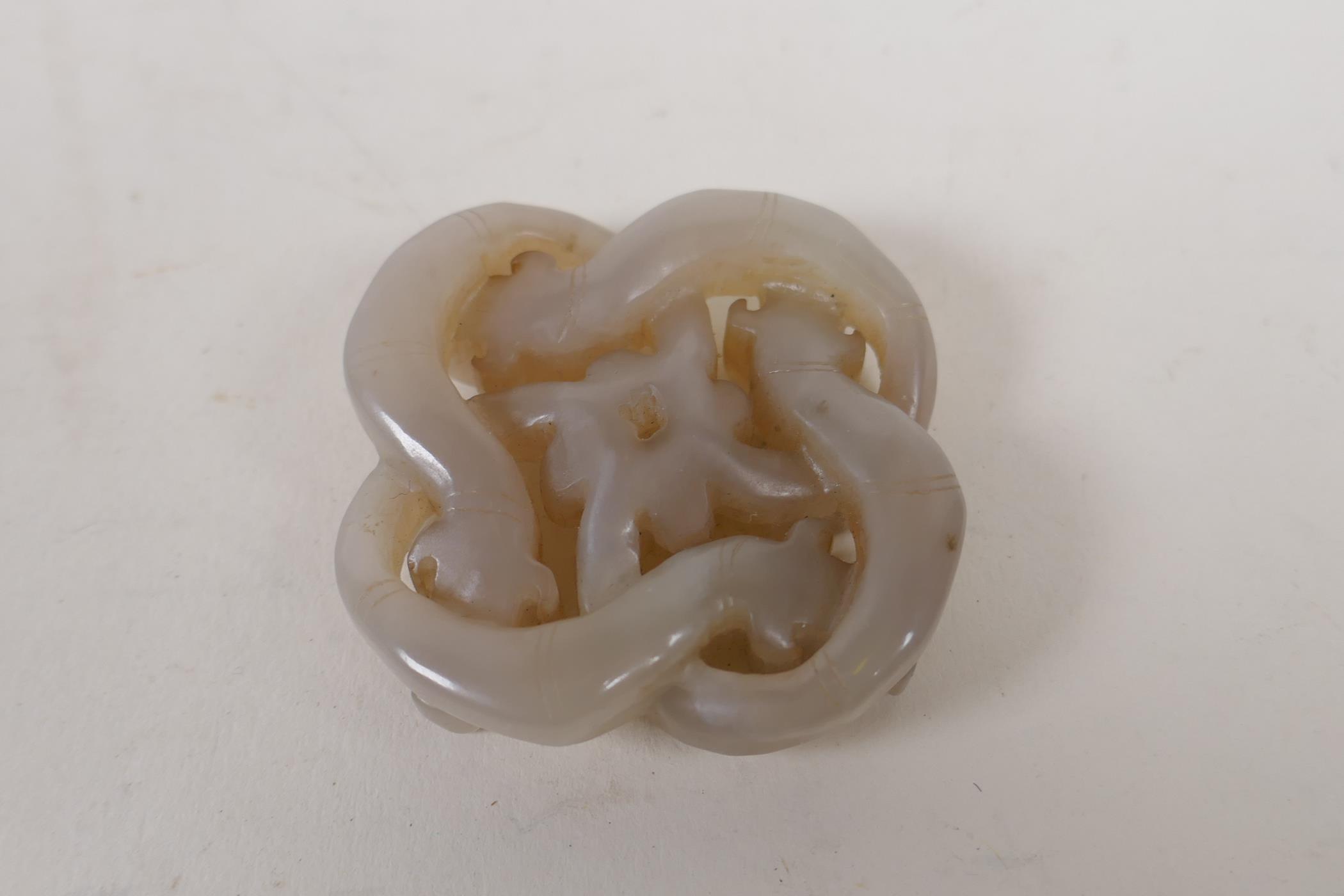 A Chinese grey jade pendant carved in the form of entwined dragons, 5cm x 5cm - Image 3 of 3