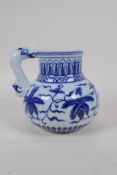 A Chinese blue and white porcelain jug with floral decoration, 4 character mark to side, 14cm high