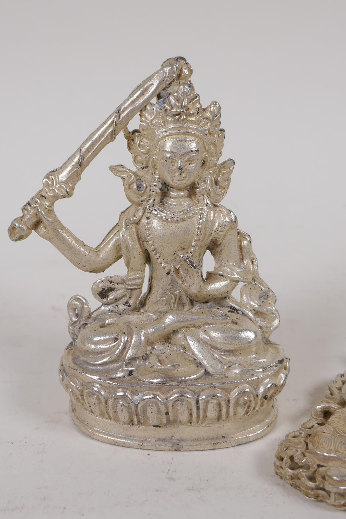 A Chinese white metal figure of a female deity, and a white metal Quan Yin pendant, largest 9cm high - Image 2 of 4