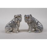 A pair of silver plated salt and pepper condiments in the form of dogs, 6cm high