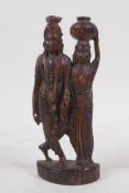 An Indian carved hardwood figure group of a man and woman in traditional clothing, 16cm high