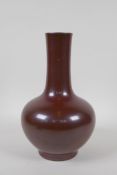 A copper lustre glazed porcelain bottle vase, Chinese Qianlong seal mark to base, 24cm high