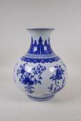 A blue and white porcelain vase decorated with flowers and fruiting peach and pomegranate trees,