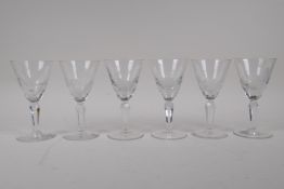 A set of six late C19th sherry glasses with etched decoration of forest animals, 13cm high