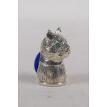 A miniature 925 silver cats head pin cushion with emerald set eyes, 2.5cm long